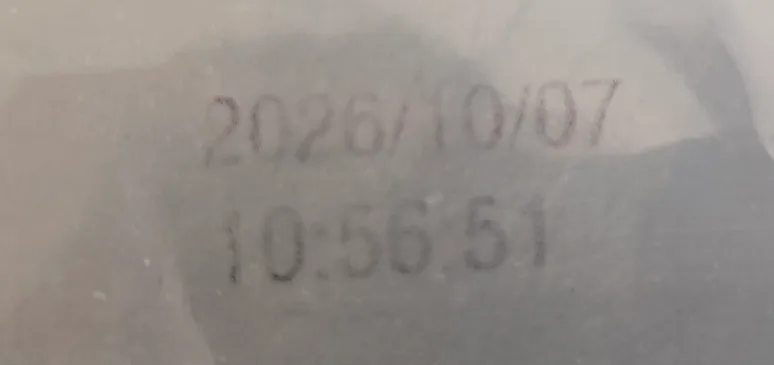 The same code after ten tape pulls: most of the mark has come away from the surface