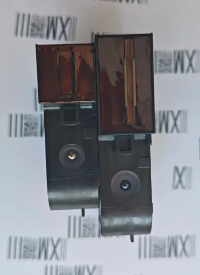 Two TIJ ink cartridges standing side by side, the wider 25.4 mm body visibly larger than the 12.7 mm body