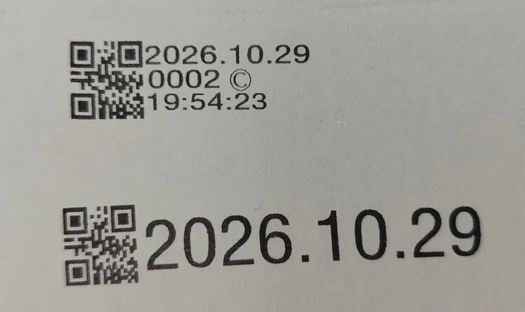Two print samples from the same solvent TIJ cartridge on the same material: a QR code with date, batch number and time stacked on three lines above, and a single large date line with a QR code below