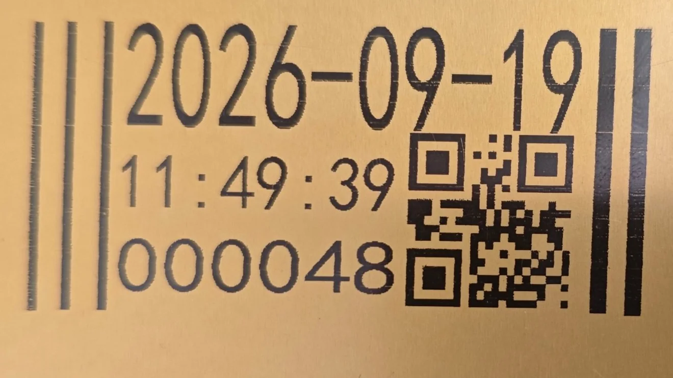 Solvent ink test print on an aluminium plate: date, time, serial number, barcode and QR code